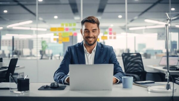 busy-young-businessman-using-laptop-600nw-2080857979