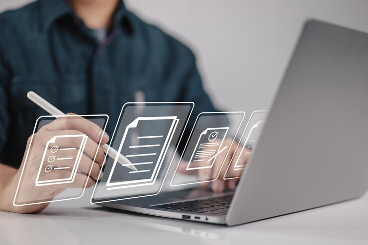 ideas-for-a-paperless-workplace-document-management-and-esigning-an-electronic-document-that-is-shown-on-the-screen-of-a-virtual-notebook-is-signed-by-a-businessman-using-a-stylus-pen_27634-1311