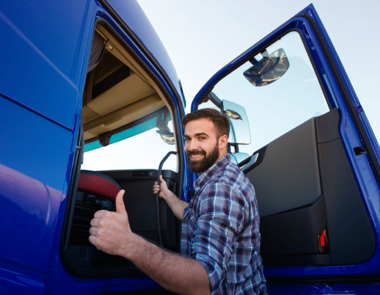 professional-truck-driver-entering-his-truck-long-vehicle-and-holding-thumbs-up_1_1