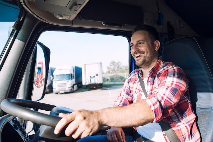 professional-middle-aged-truck-driver-in-casual-clothes-driving-truck-vehicle-and-delivering-cargo-to-destination_342744-1286_1
