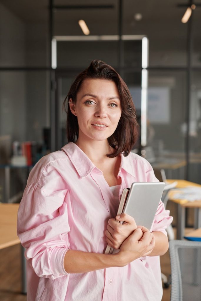 portrait-of-young-businesswoman-in-office-2023-11-27-05-07-14-utc-683x1024