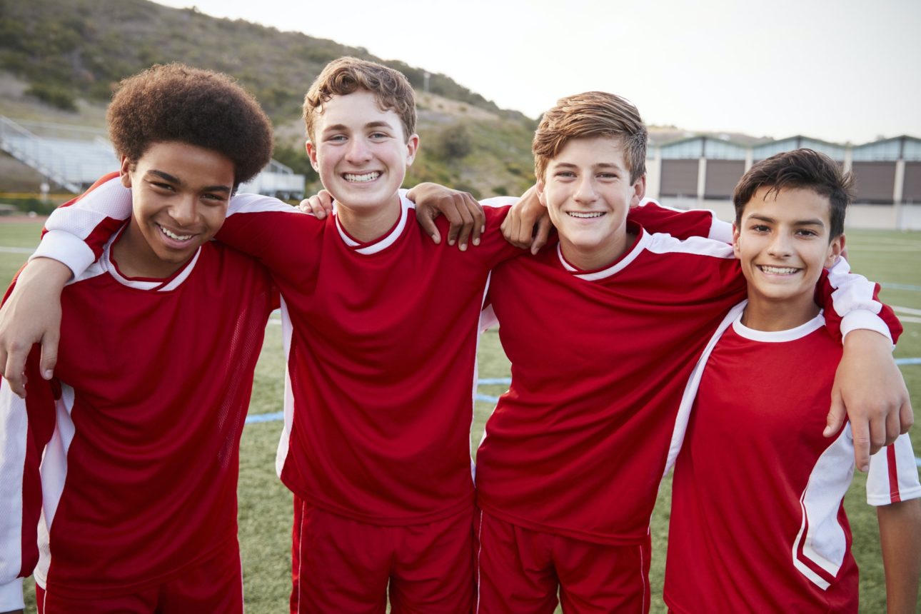 portrait-of-male-high-school-students-playing-in-soccer-team-e1615764588509
