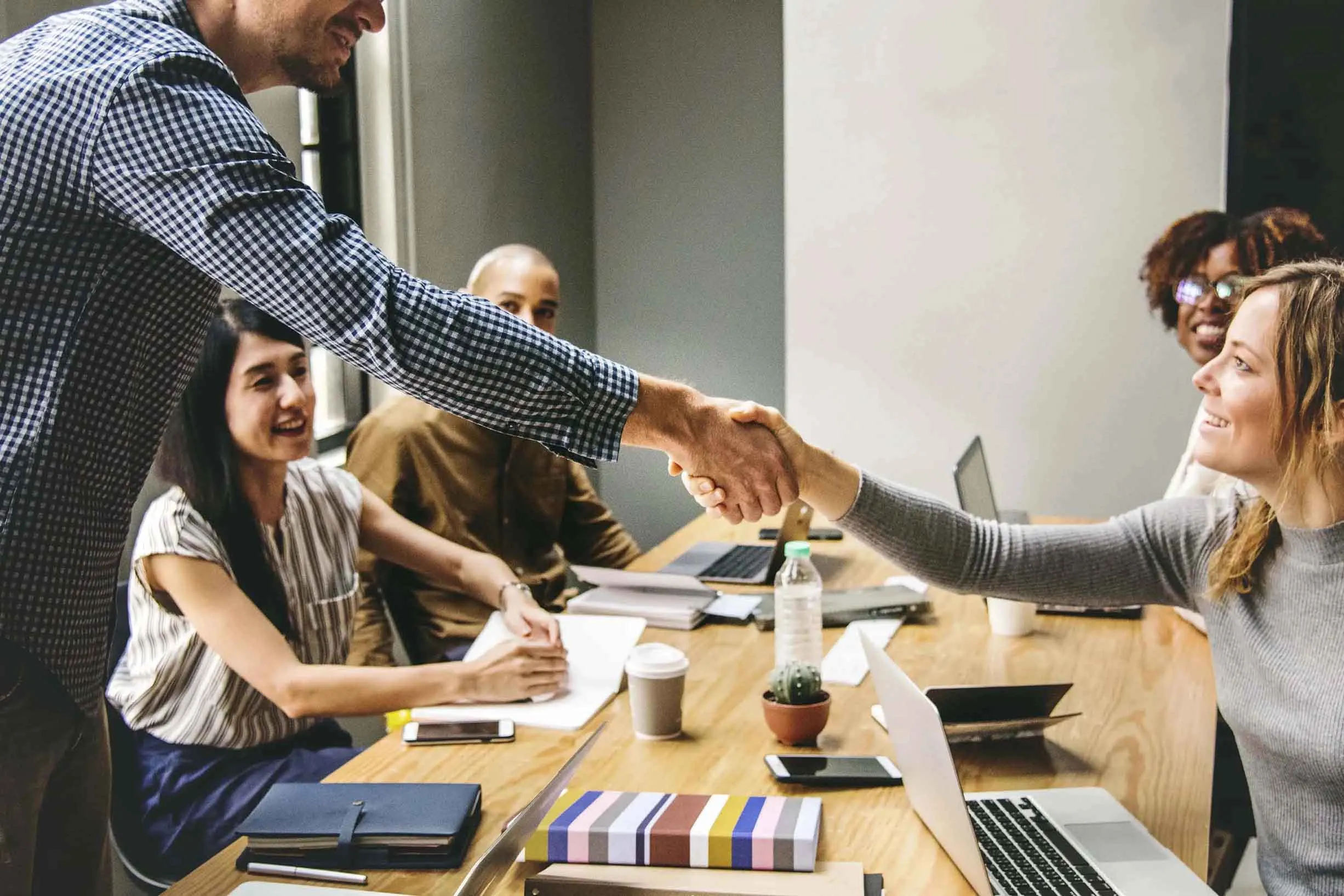business-people-shaking-hands-agreement