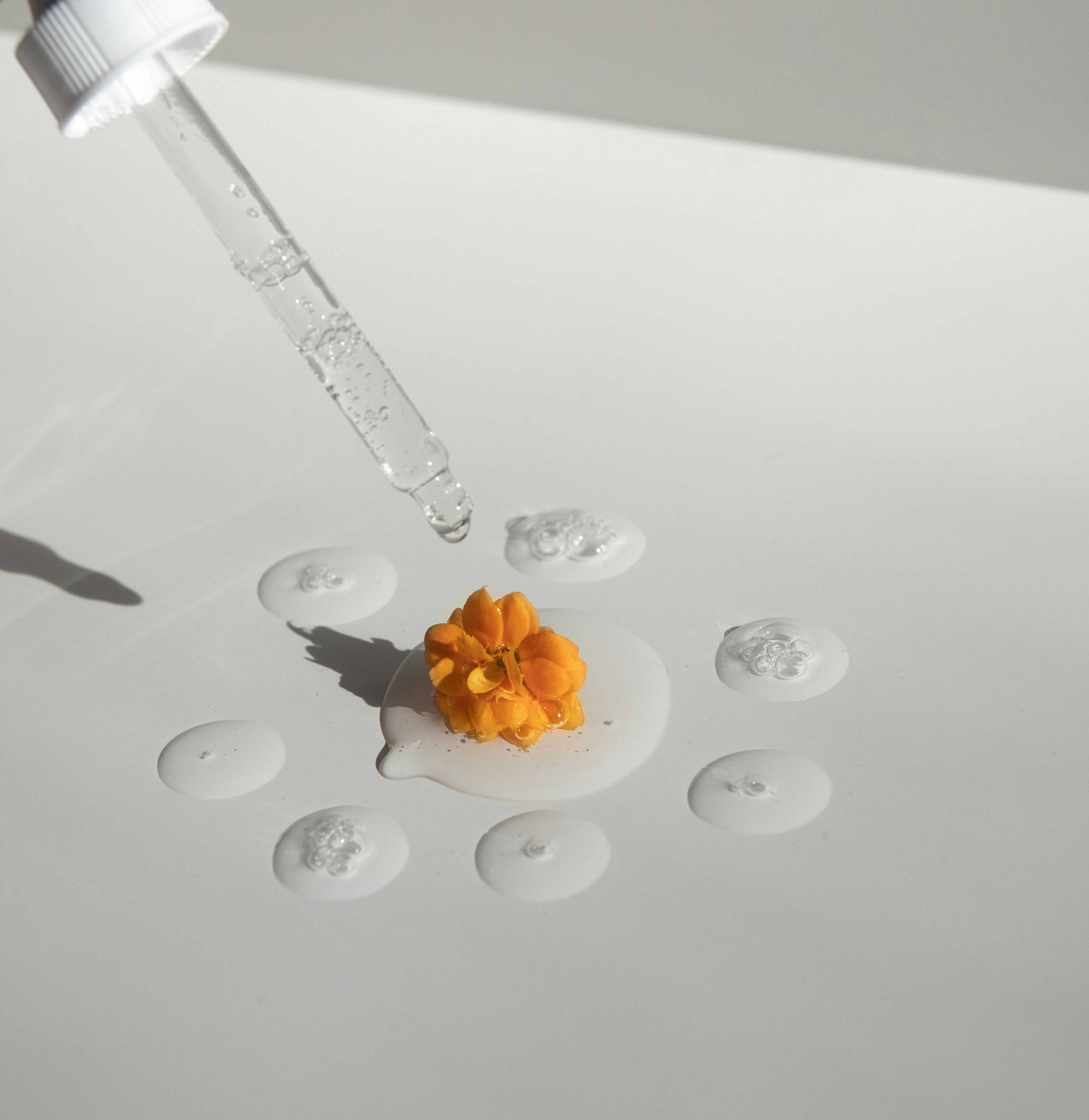 dropper-on-orange-flower