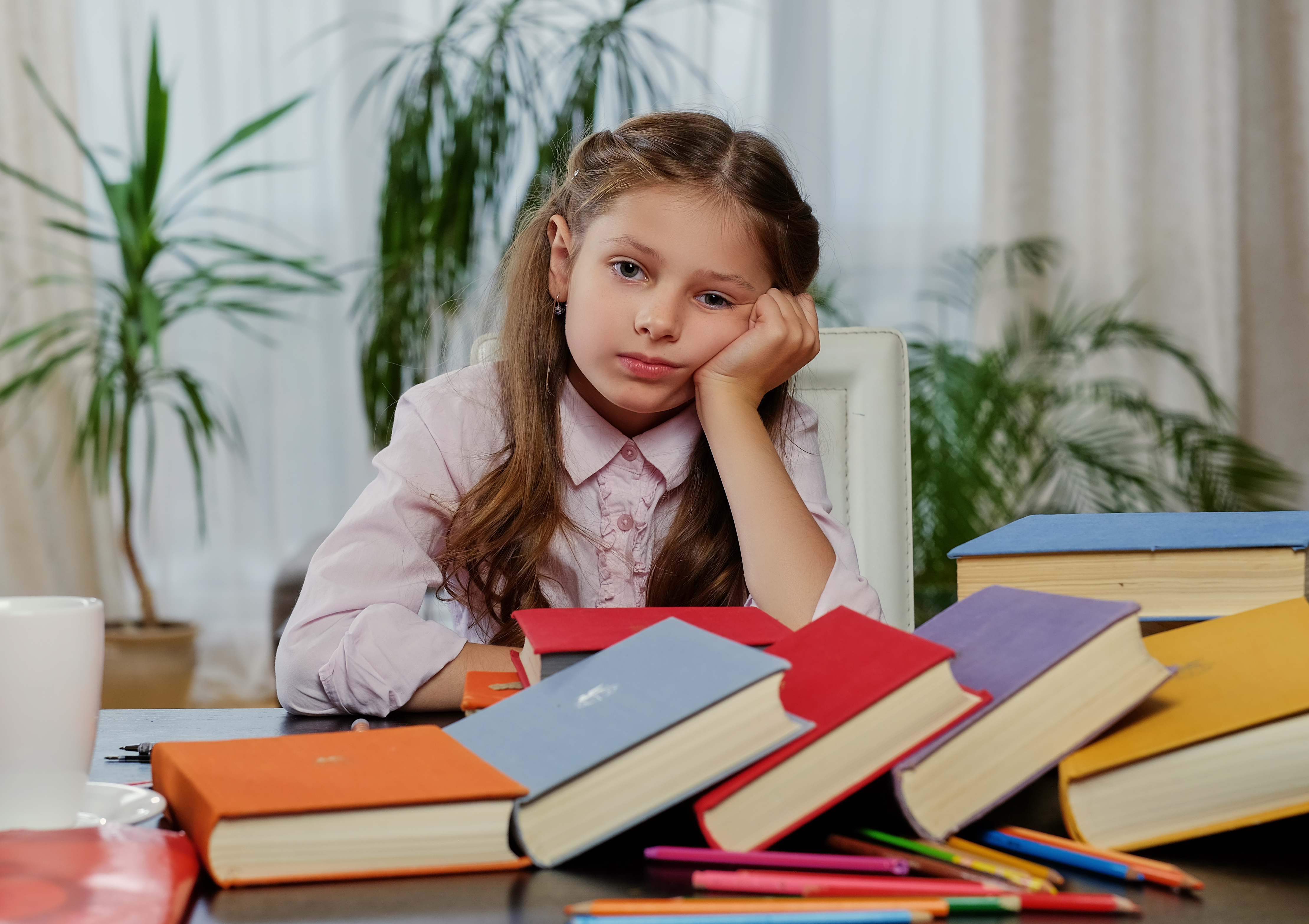 tired-little-girl-after-studying-reading-lot-books